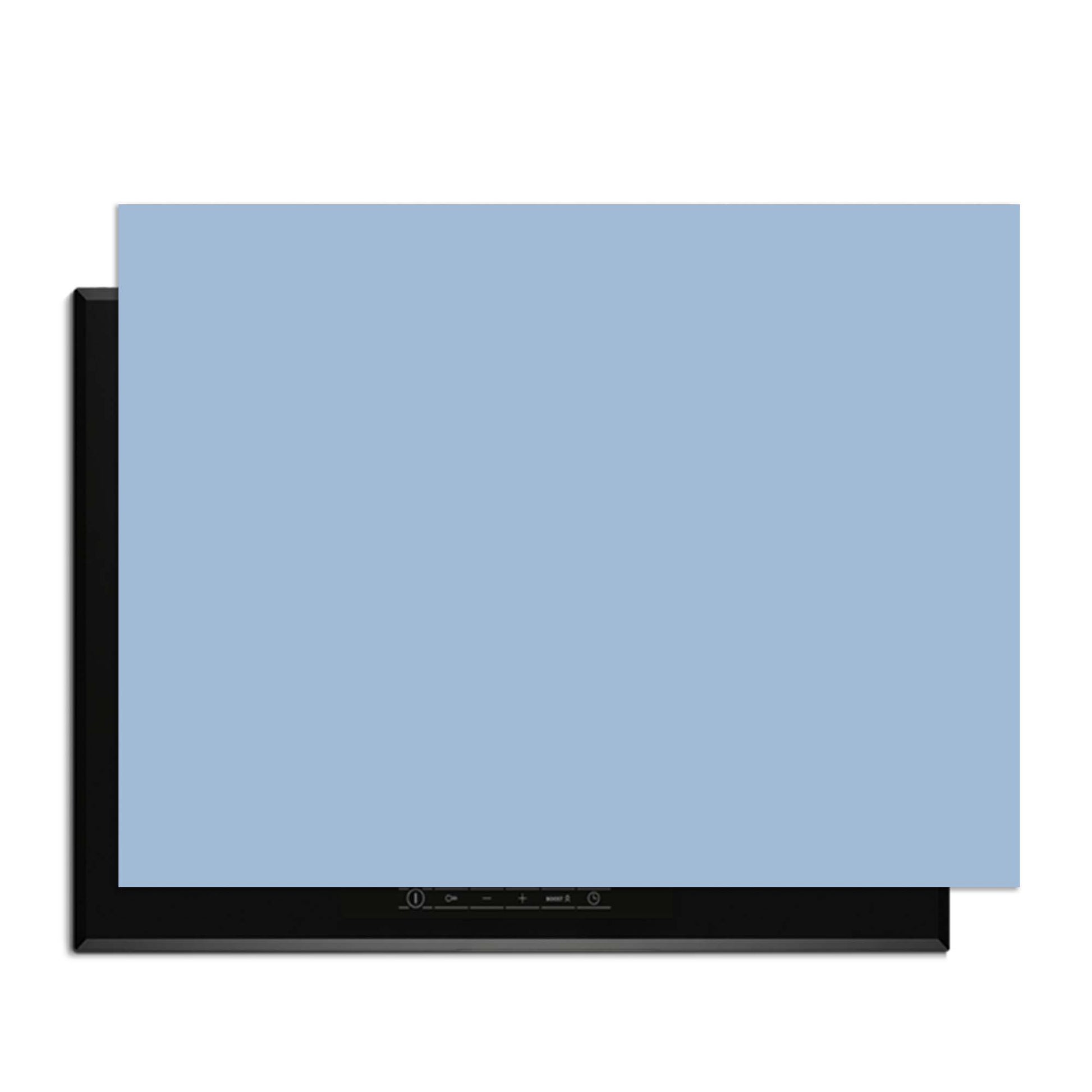 Clear Sky – Inductie Beschermer op een inductiekookplaat met een zacht blauwe tint