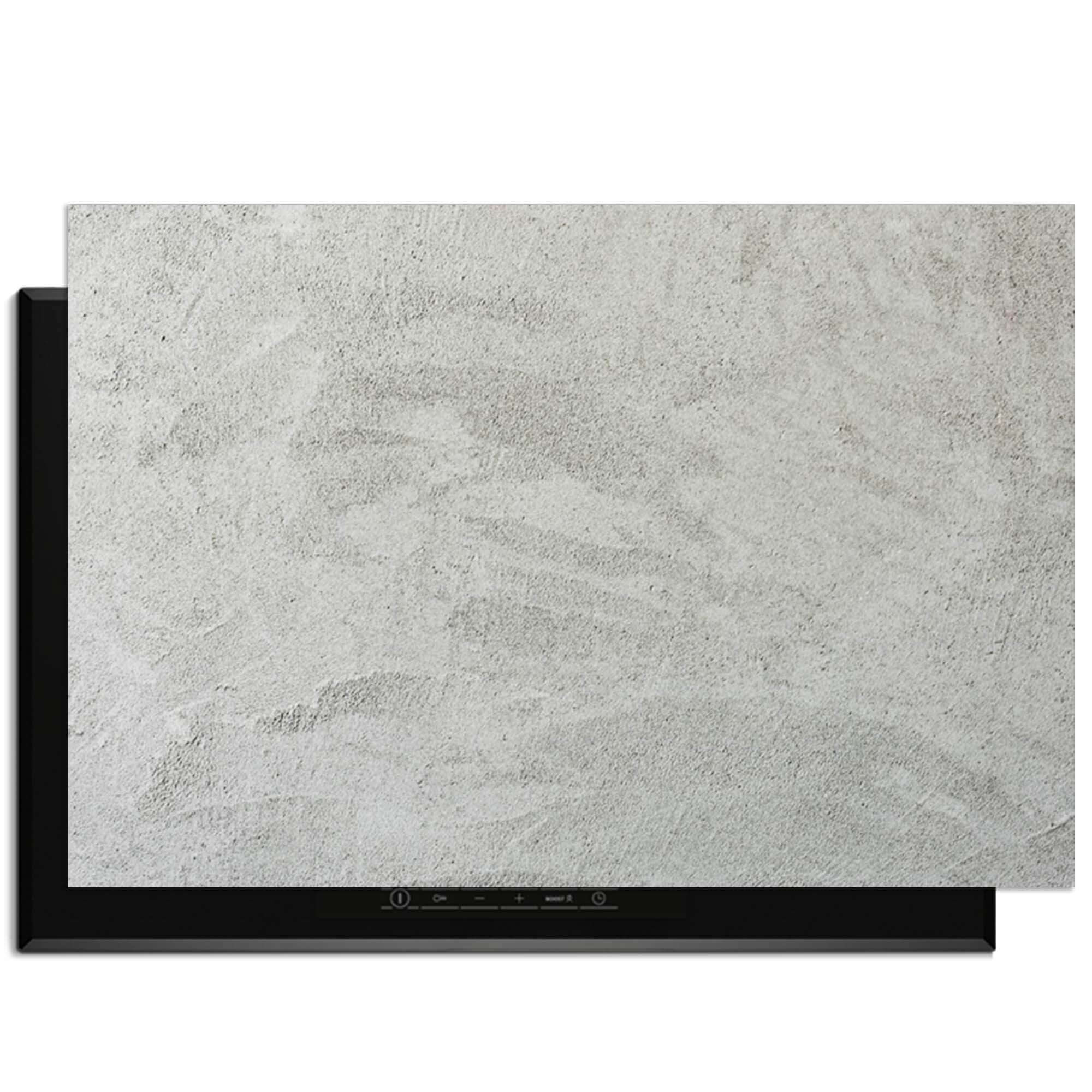 Inductiebeschermer met zachte betonlook design op kookplaat