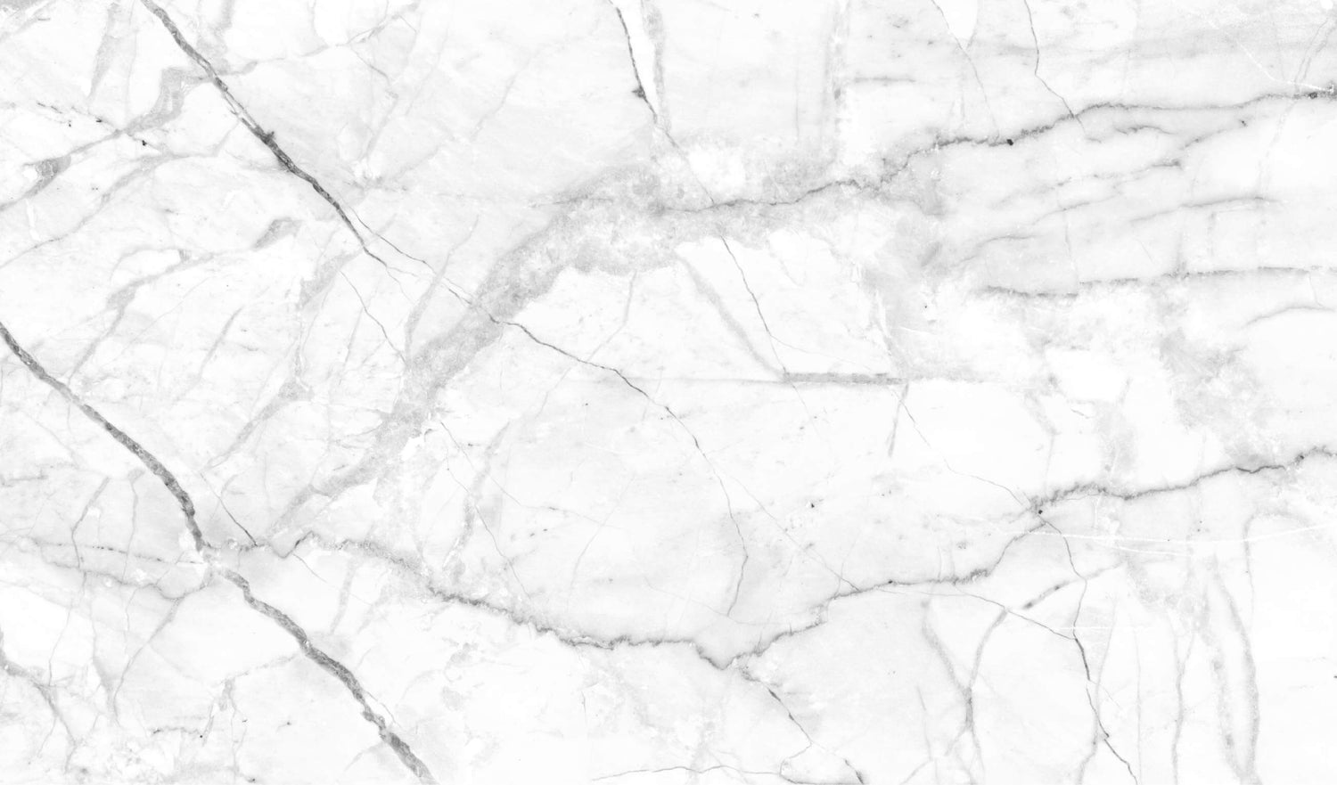 Elegant white marble background with fine gray veining, ideal for design and decor projects.