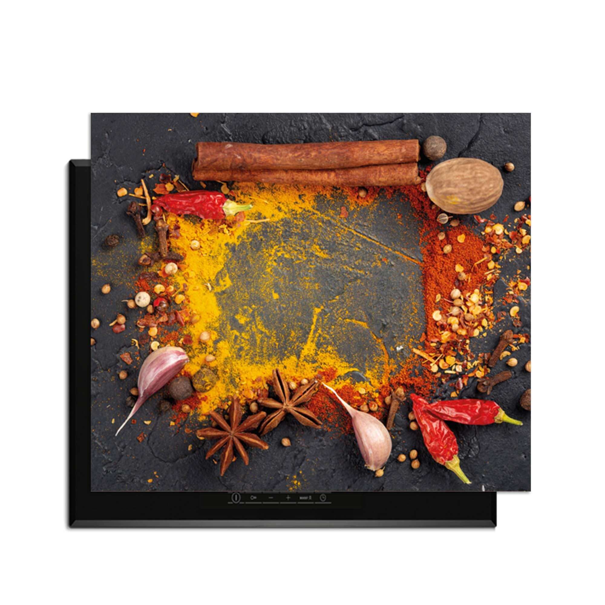 Eastern Spice Mix - Induction Protector mit bunten Gewürzen auf dem Induktionskochfeld.