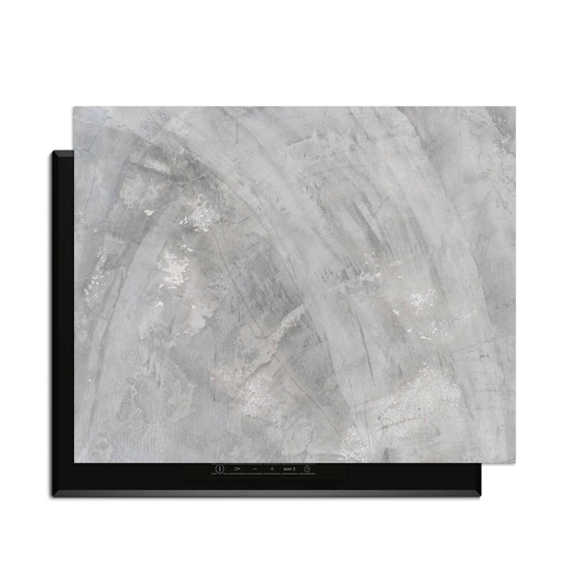 Concrete Flow - Induktionsschutzplatte mit weichen Grautönen und fließenden Mustern für eine moderne Küche.