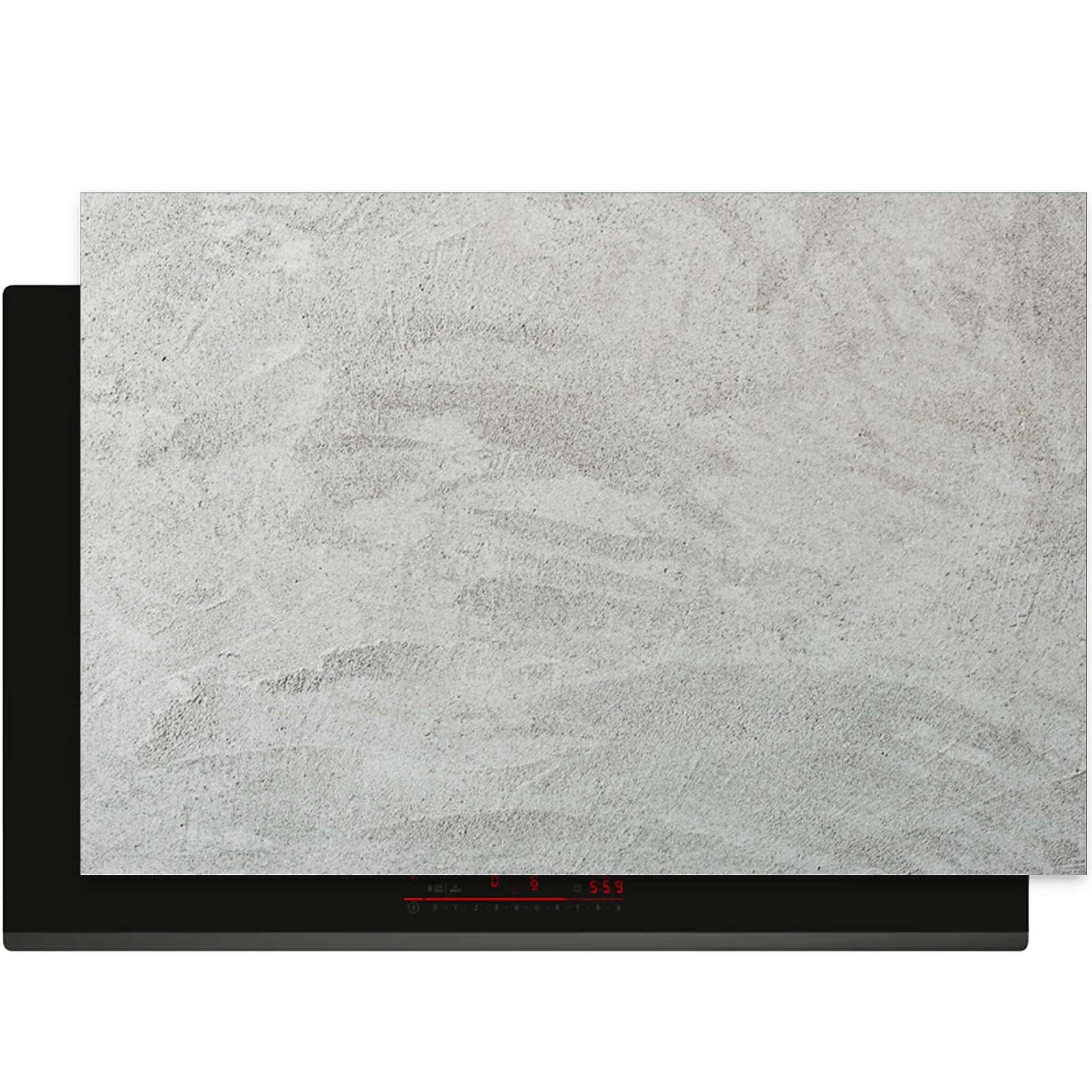 Inductiebeschermer met zachte betonlook design op kookplaat