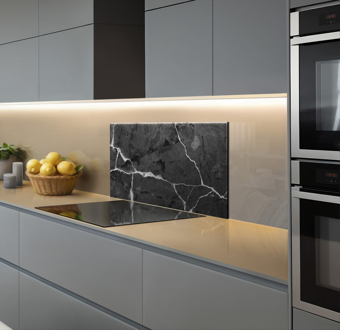 Modern kitchen featuring a sleek dark marble backsplash with elegant veins, stylish cabinets, and a minimalist design.